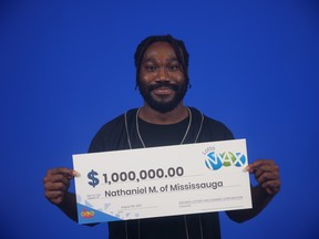 Nathaniel Marksman from Mississauga is pictured with his Lotto Max cheque.
