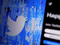 The Twitter splash page is displayed on a digital device in San Diego, April 25, 2022.