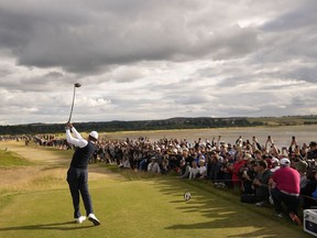 Tiger Woods of the US plays from the 12th tee during the first round of the British Open golf championship on the Old Course at St. Andrews, Scotland, Thursday, July 14, 2022.