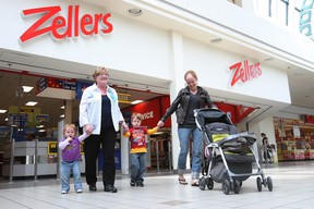 Shoppers walk past the Zellers store at the Woodbine Centre in Etobicoke on May 26, 2011.