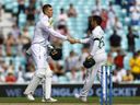 England's Zak Crawley and South Africa's Dean Elgar shake hands after the end of a cricket Test match on Sept. 12, 2022.