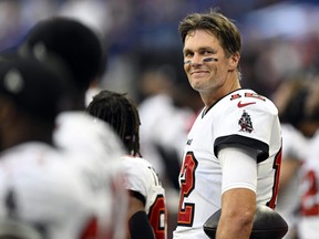 Tampa Bay Buccaneers quarterback Tom Brady (12) smiles during the national anthem before the game against the Indianapolis Colts.
