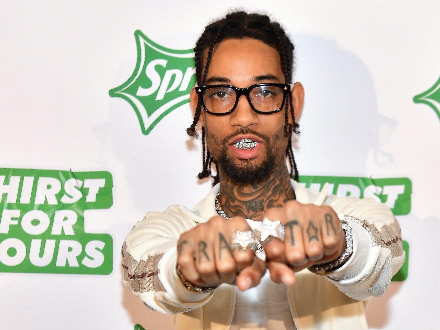 Father, Teenage Son Charged In Killing Of Rapper Pnb Rock 