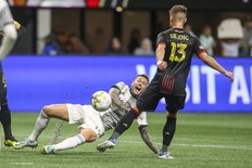 Toronto FC forward Federico Bernardeschi (10) controls the ball against Atlanta United midfielder Amar Sejdic.