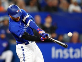 George Springe of the Toronto Blue Jays hits a two-run home run in the seventh inning during game two of a doubleheader against the Tampa Bay Rays at Rogers Centre on September 13, 2022 in Toronto, Ontario, Canada.