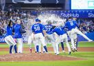 Teammates splash Vladimir Guerrero Jr. #27 of the Toronto Blue Jays with water after his walk-off hit to defeat the New York Yankees in the tenth inning during their MLB game at the Rogers Centre on September 26, 2022 in Toronto. (Photo by Mark Blinch/Getty Images)