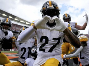 Pittsburgh Steelers linebacker Marcus Allen (27) and the defence celebrate an interception by cornerback Ahkello Witherspoon (not pictured).