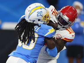 Tyreek Hill #10 of the Kansas City Chiefs catches a touchdown reception over Tevaughn Campbell #20 of the Los Angeles Chargers during the fourth quarter at SoFi Stadium on December 16, 2021 in Inglewood, California.
