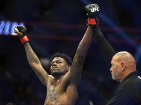 Kevin Holland celebrates his TKO victory over Alex Oliveira of Brazil after their catchweight fight during UFC 272 at T-Mobile Arena on March 05, 2022 in Las Vegas, Nevada.