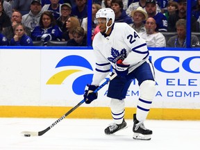 Wayne Simmonds of the Toronto Maple Leafs looks to pass in the third period during a game against the Tampa Bay Lightning at Amalie Arena on April 04, 2022 in Tampa, Florida.