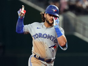 Bo Bichette of the Toronto Blue Jays gestures as he runs the bases after a two-run home run against the Texas Rangers in the third inning at Globe Life Field on September 09, 2022 in Arlington, Texas. (Photo by Richard Rodriguez/Getty Images)