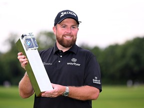 Shane Lowry of Ireland celebrates with the winners trophy on the 18th green after the final round of the BMW PGA Championship at Wentworth Golf Club on September 11, 2022 in Virginia Water, England.