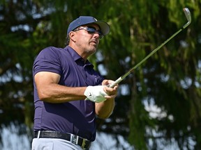 Team Captain Phil Mickelson of Hy Flyers GC plays his shot on the third tee during Day One of the LIV Golf Invitational - Chicago at Rich Harvest Farms on September 16, 2022 in Sugar Grove, Illinois.