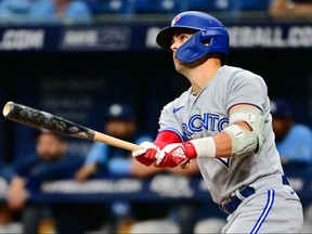 Whit Merrifield #1 of the Toronto Blue Jays hits a home run in the second inning against the Tampa Bay Rays at Tropicana Field on September 22, 2022 in St Petersburg, Florida.