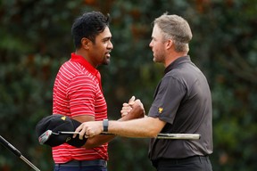 Tony Finau of the United States Team shakes hands with Taylor Pendrith of Canada and the International Team after Finau won 3&1 during Sunday singles matches on day four of the 2022 Presidents Cup at Quail Hollow Country Club on September 25, 2022 in Charlotte, North Carolina. (Photo by Jared C. Tilton/Getty Images)