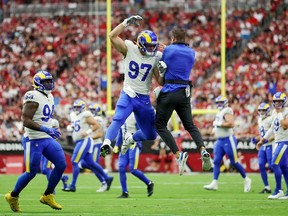 Michael Hoecht #97 of the Los Angeles Rams celebrates with head coach Sean McVay after tipping a punt by the Arizona Cardinals during the first quarter at State Farm Stadium on September 25, 2022 in Glendale, Arizona.