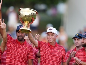 Captain Davis Love III of the United States Team celebrates with the Presidents Cup alongside the team during the closing ceremony after defeating the International Team during Sunday singles matches on day four of the 2022 Presidents Cup at Quail Hollow Country Club on September 25, 2022 in Charlotte, North Carolina.