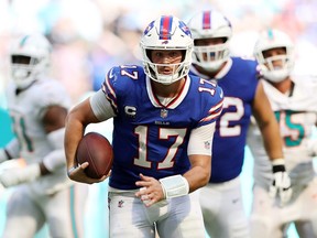 Josh Allen #17 of the Buffalo Bills runs with the ball during the fourth quarter against the Miami Dolphins at Hard Rock Stadium on September 25, 2022 in Miami Gardens, Florida.