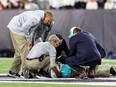 Medical staff tend to quarterback Tua Tagovailoa #1 of the Miami Dolphins after an injury during the 2nd quarter of the game against the Cincinnati Bengals at Paycor Stadium on Sept. 29.