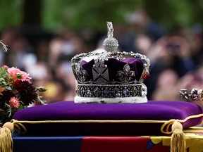 The royal crown is seen as the procession carries the coffin on the day of the state funeral and burial of Queen Elizabeth, in London September 19, 2022.