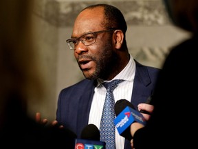 Minister of Labour and Immigration Kaycee Madu speaks to the media inside the Alberta Legislature in Edmonton, May 3, 2022.