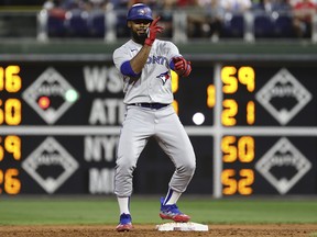 Teoscar Hernandez  of the Toronto Blue Jays reacts after hitting a double during the third inning against the Philadelphia Phillies.