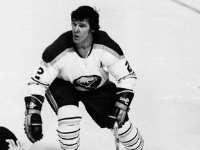 Canadian professional hockey player Tim Horton (1930 - 1974) of the Buffalo Sabres skates during a game, mid 1970s.