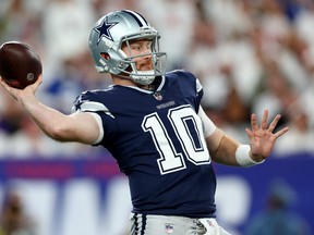Cooper Rush of the Dallas Cowboys throws a pass against the New York Giants.