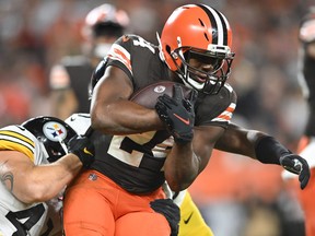 Nick Chubb of the Cleveland Browns carries the ball during the third quarter ahead of Robert Spillane of the Pittsburgh Steelers.