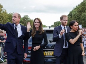 Britain's Prince William, Prince of Wales, Britain's Catherine, Princess of Wales, Britain's Prince Harry, Duke of Sussex, Britain's Meghan, Duchess of Sussex, wave at well-wishers on the Long walk at Windsor Castle on Sept. 10, 2022.