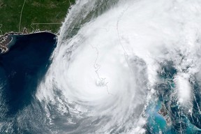 This handout satellite image courtesy of the U.S. Regional and Mesoscale Meteorology Branch (RAMMB) shows the eye of Hurricane Ian making landfall near Cayo Costa, Fla., on Sept. 28, 2022.