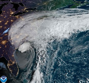 This National Oceanic and Atmospheric Administration (NOAA) satellite handout image shows Hurricane Ian on Sept. 30, 2022 at 12:01 UTC.