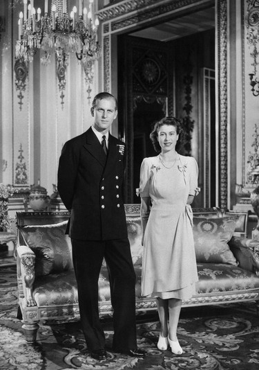 In this file photo taken on July 09, 1947 Princess Elizabeth (L) (future Queen Elizabeth II) and her Fiance Philip Mountbatten (R) (the future Duke of Edinburgh) pose in Buckingham Palace in London on July 9, 1947 in London, the day their engagement was officially announced. - Queen Elizabeth II's 99-year-old husband Prince Philip, who was recently hospitalised and underwent a successful heart procedure, died on April 9, 2021, Buckingham Palace announced. (AFP via Getty Images)