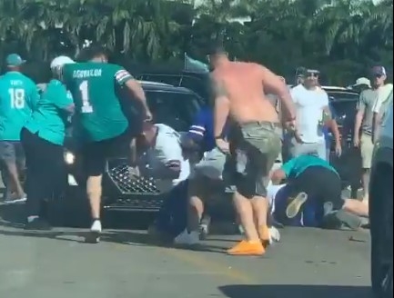 Bills fan gets kicked in the teeth during fight between Miami and Buffalo  fans at tailgate