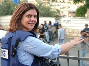This handout file picture obtained from a former colleague of Al-Jazeera's slain veteran TV journalist Shireen Abu Akleh, shows her reporting from Jerusalem on June 12, 2021.