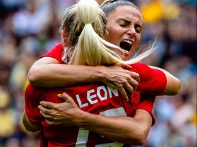 Canada's Adriana Leon, left, celebrates with Shelina Zadorsky after scoring a goal during the women's friendly soccer match between Australia and Canada in Brisbane on Sept. 3, 2022.