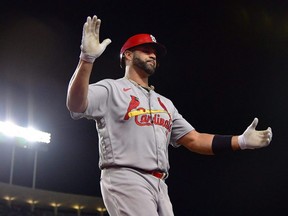 Cardinals designated hitter Albert Pujols reacts after hitting a two-run home run against the Dodgers during the third inning at Dodger Stadium in Los Angeles, Friday, Sept. 23, 2022. The home run was the 699th of his career.