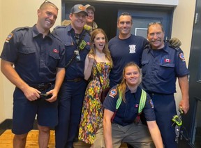 Actor Anna Kendrick poses with Toronto firefighters (from left to right) Brian White, Mike Dinsmore, Shane Elliot, Scott Fitzpatrick, Scott Tyrrell, and Megan Campbell, who work out of Toronto Fire Service Stations 332 and 331 respectively.