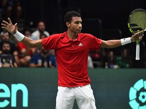 Canada's Felix Auger-Aliassime celebrates winning against Spain's Carlos Alcaraz during the Davis Cup at the Fuente San Luis Sports Hall in Valencia, on September 16, 2022.