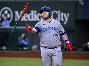 Sep 11, 2022; Arlington, Texas, USA; Toronto Blue Jays catcher Alejandro Kirk tosses his bat after he strikes out against the Texas Rangers during the eighth inning at Globe Life Field.