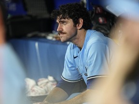 Blue Jays closer Jordan Romano sits in the dugout after giving up three runs to the Baltimore Orioles during the ninth inning at Rogers Centre on Sunday.