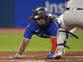 Blue Jays first baseman Vladimir Guerrero Jr. slides into home plate against the New York Yankees at Rogers Centre.