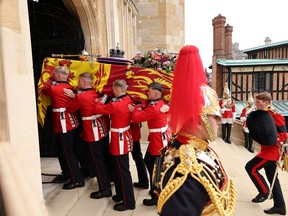 The coffin of Queen Elizabeth is transported to St George's Chapel at Windsor Castle after the state funeral held Westminster Abbey  September 19, 2022.