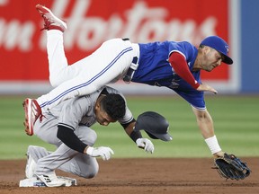 Oswald Peraza of the New York Yankees collides with Whit Merrifield of the Toronto Blue Jays at second base at Rogers Centre on September 28, 2022 in Toronto.