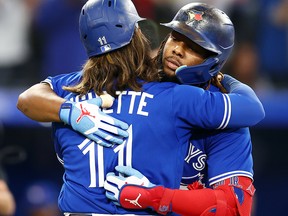 Vladimir Guerrero Jr. of the Toronto Blue Jays celebrates with Bo Bichette after hitting a home run against the Boston Red Sox at Rogers Centre on September 30, 2022 in Toronto.