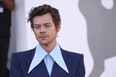 Harry Styles poses for photographers upon arrival at the premiere of the film 'Don't Worry Darling' during the 79th edition of the Venice Film Festival in Venice, Italy, Monday, Sept. 5, 2022.