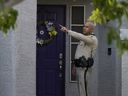 A police officer stands at the front door of the house of Clark County Public Administrator Robert Telles, Wednesday, Sept. 7, 2022, in Las Vegas. 