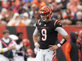 Cincinnati Bengals quarterback Joe Burrow  pauses between plays during the first half of an NFL football game against the Pittsburgh Steelers, Sunday, Sept. 11, 2022, in Cincinnati. Burrow, who did not play a snap in the pre-season, had a horrific, turnover-filled season opener.