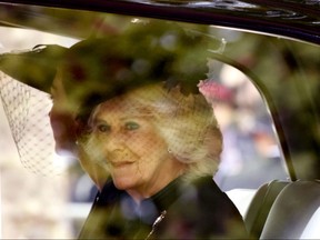 Camilla, the Queen Consort, sits in a car before attending the State Funeral Service of Britain's Queen Elizabeth II in central London Monday, Sept. 19, 2022. The Queen, who died aged 96 on Sept. 8, will be buried at Windsor alongside her late husband, Prince Philip, who died last year. (AP Photo/David Cliff, Pool)