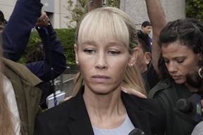 Sherri Papini leaves the courthouse after a federal judge sentenced her to 18 months in federal prison, in Sacramento, Calif., Sept. 19, 2022. Files